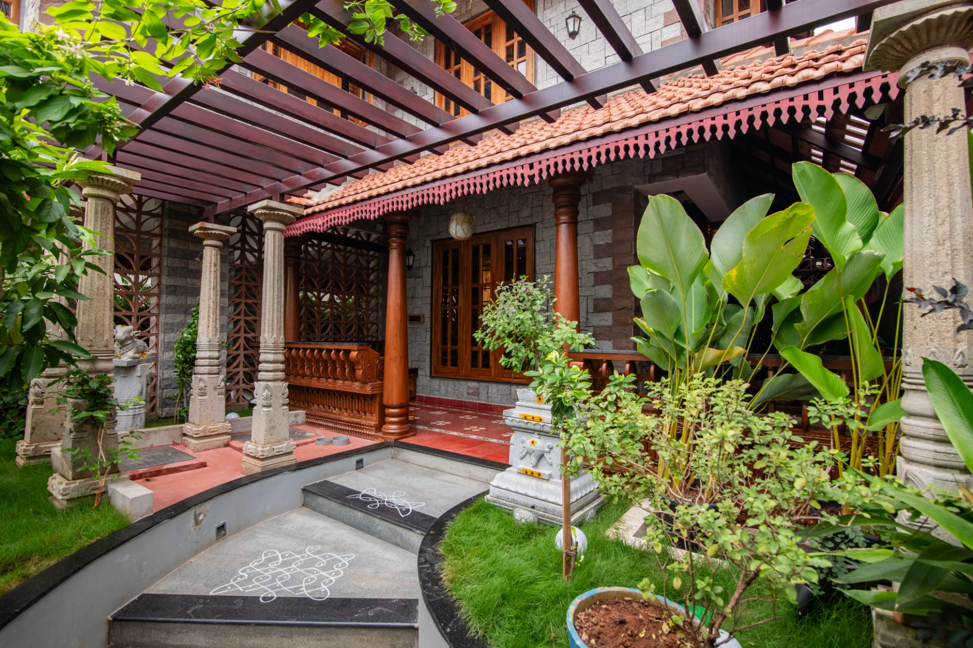 Traditional verandah with carved columns by Montimers